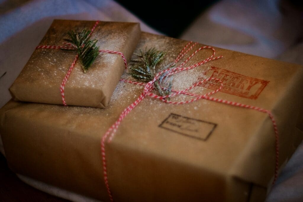 Wrapped holiday packages with twine and greenery, ready for eCommerce order fulfillment and shipping