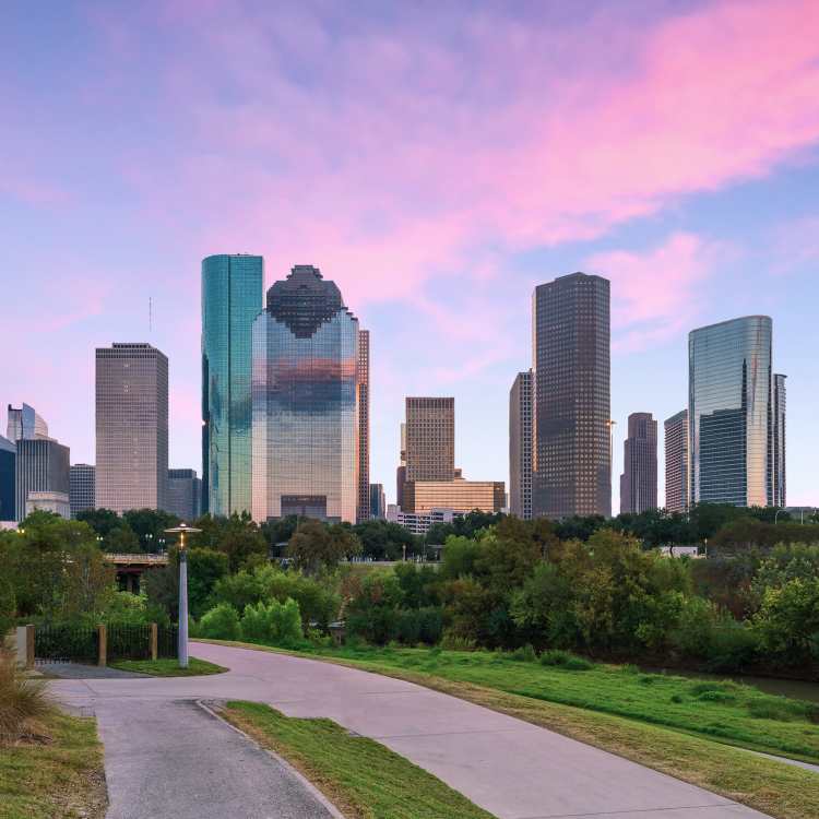 Houston skyline at sunset with skyscrapers and park in foreground, logistic solutions backdrop