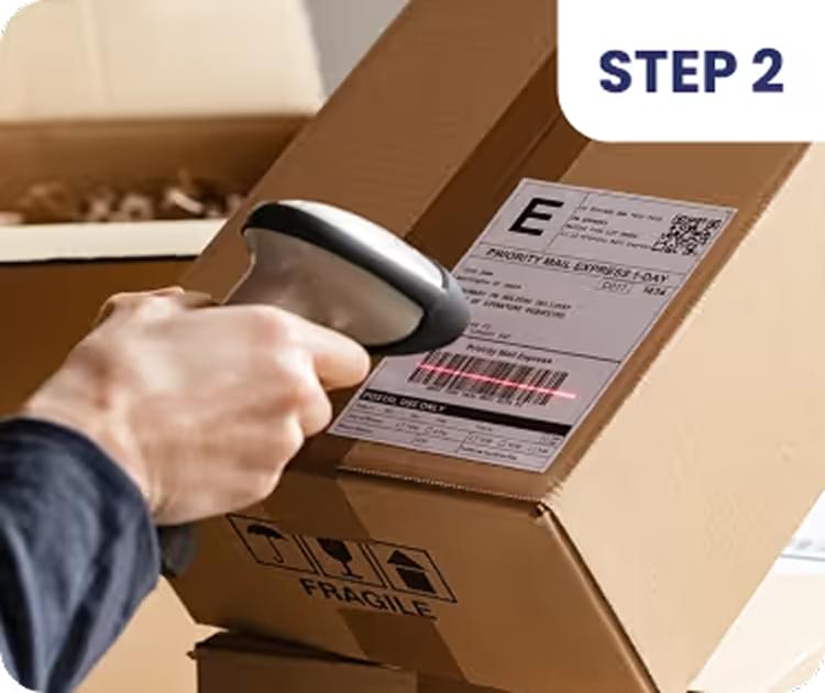 Scanning shipping label on brown package for delivery tracking, ecommerce order fulfillment process