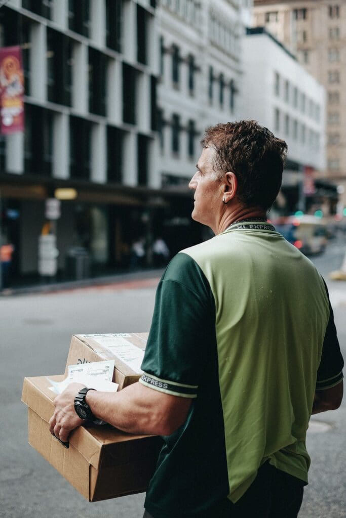 delivery person holding two boxes