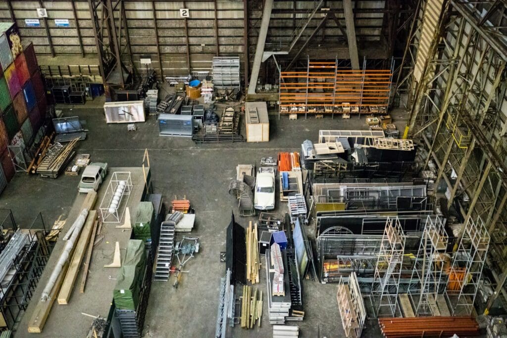 A messy warehouse that looks like it's being demolished or renovated